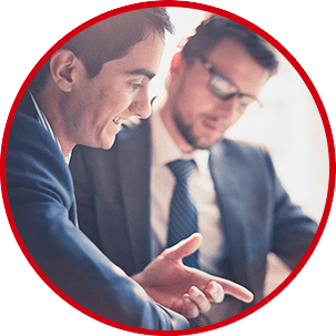 Image of two people working together.