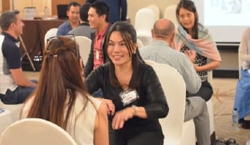 Picture of smiling students at an NLP Top Coach event.