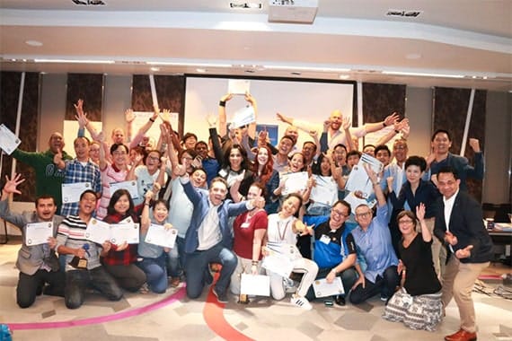 Image of students at an NLP Top Coach conference.