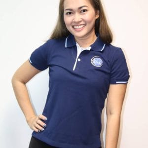 Image of a woman modeling an NLP Top Coach shirt.