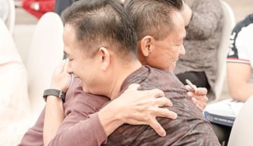 Image of two people who are enjoying the NLP Top Coach program.