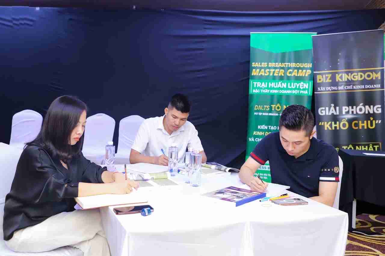 Students during a business coaching certification program going through course material.