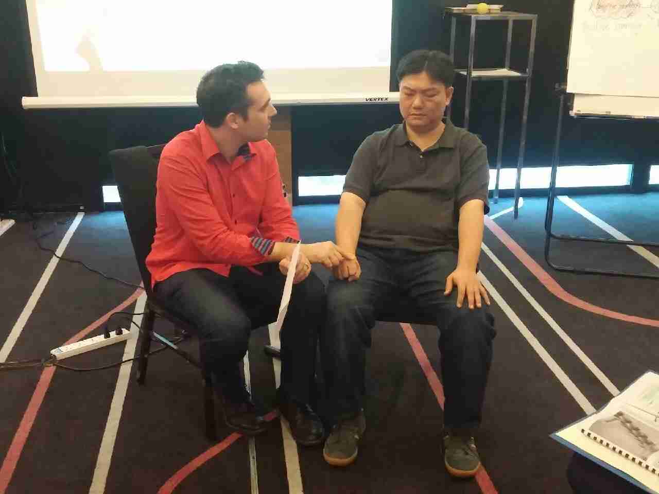 Picture of trainer Sebastian LeBlond working with people who are becoming a hypnotherapist.