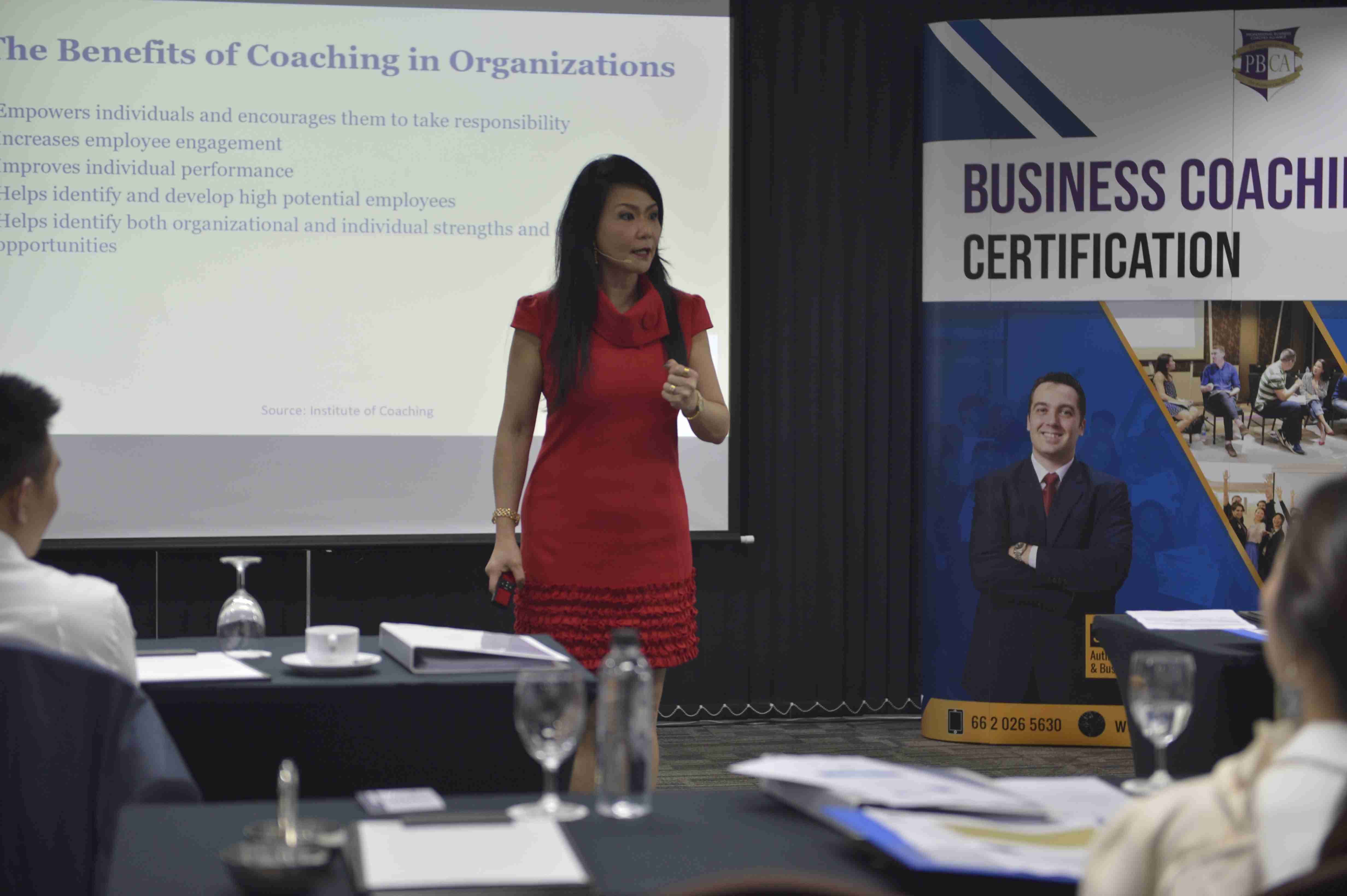 Professional Trainer Gloria Soo working with a professional business coaching association training class.