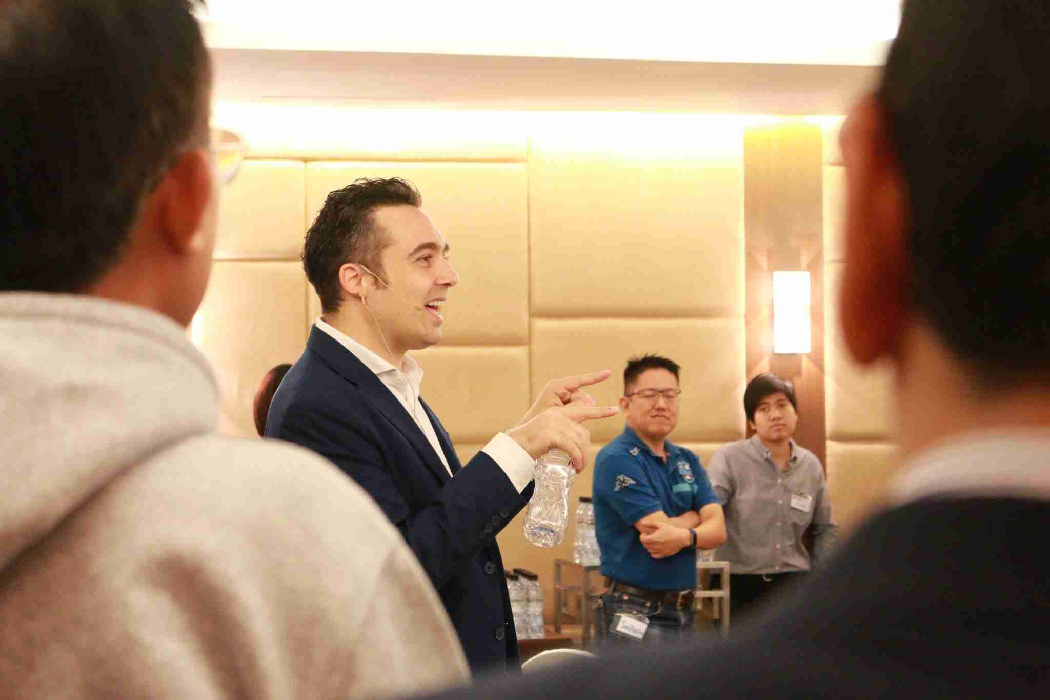 Picture of Sebastian LeBlond working with a course as a business coach.