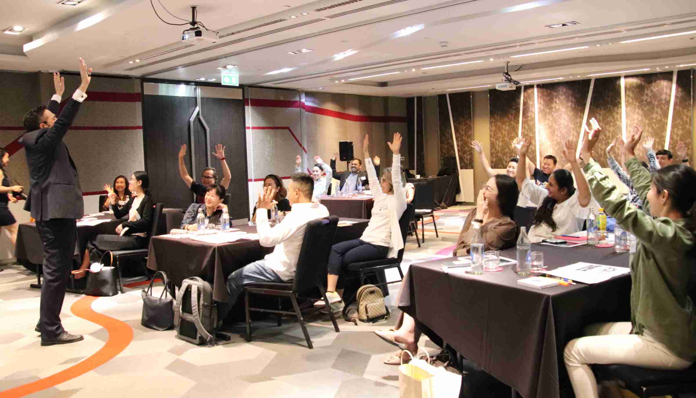 Picture of Sebastian LeBlond working with a class of students in an ICF Training course.
