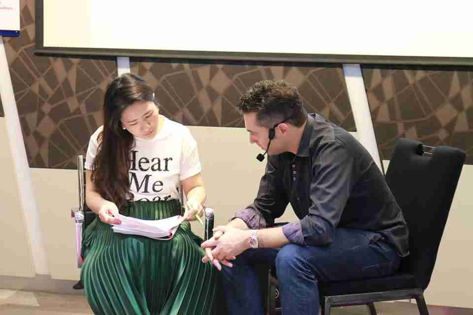 Sebastian LeBlond working with a student in an ICF certification course.