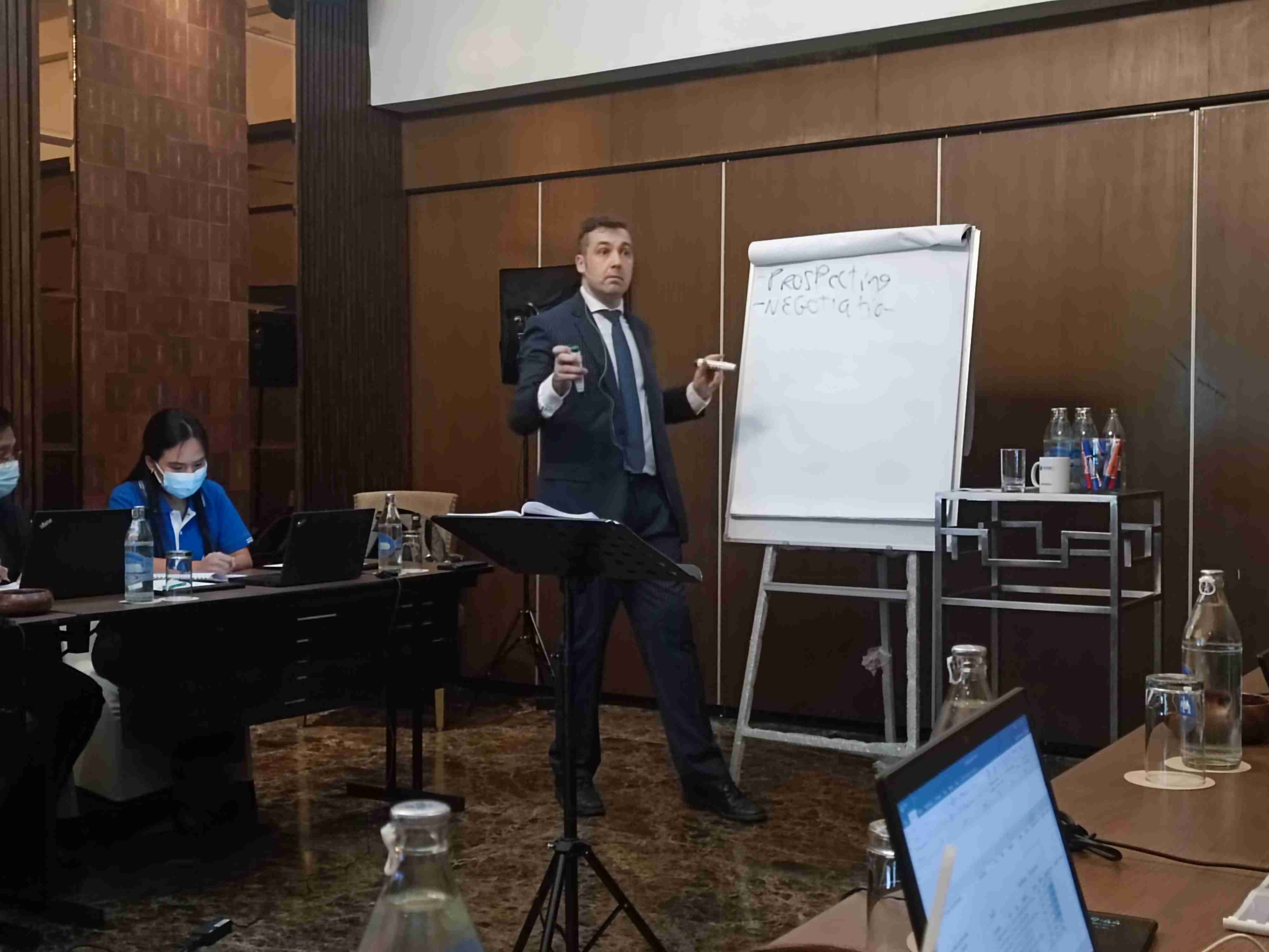 Sebastien Leblond teaching how to use NLP in sales to a group of trainees in an NLP Top Coach corporate training session.