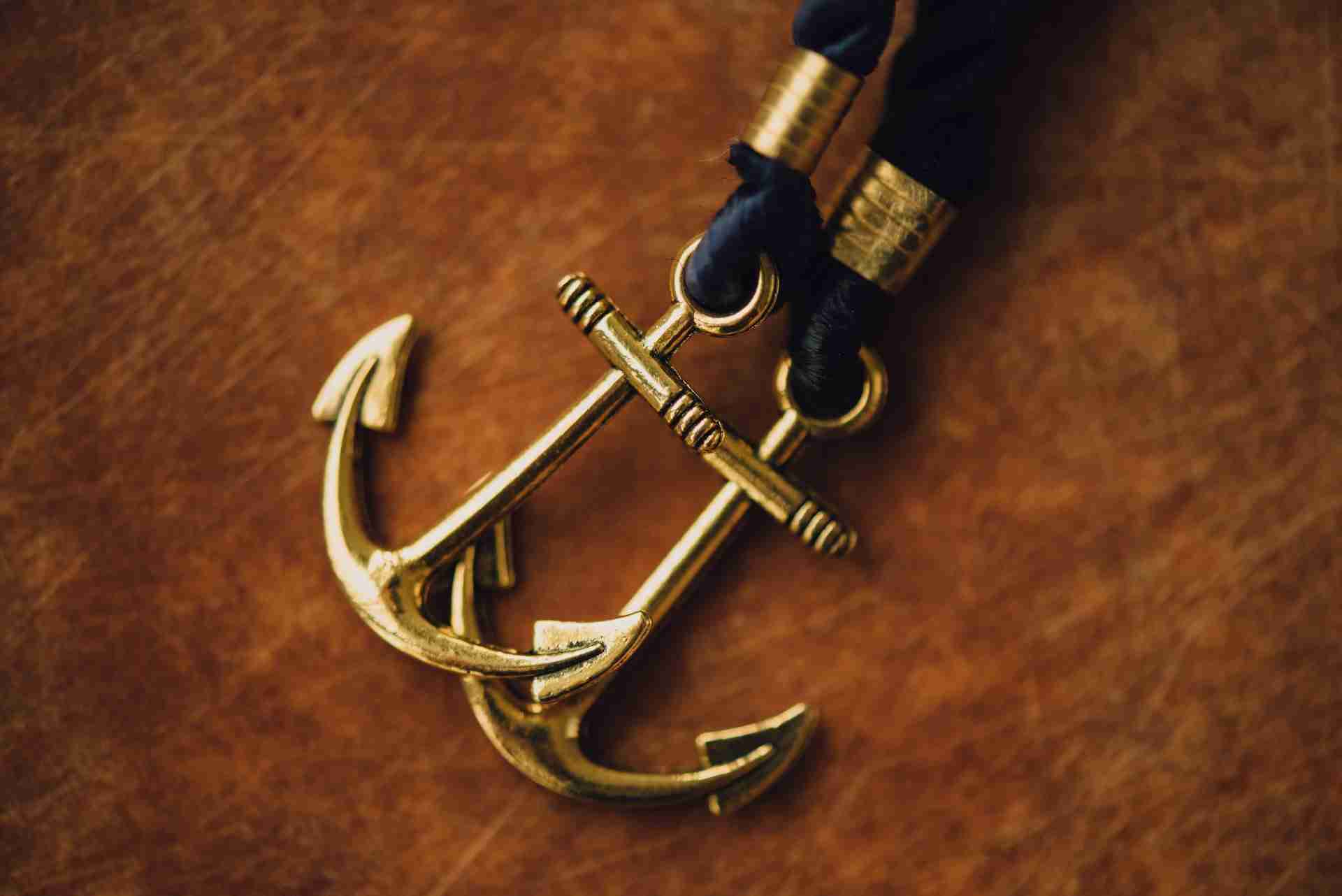 two anchor pendants representing anchoring in NLP